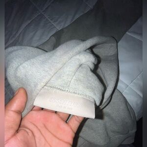 Essential hoodie can be for boys and girls size small color grey